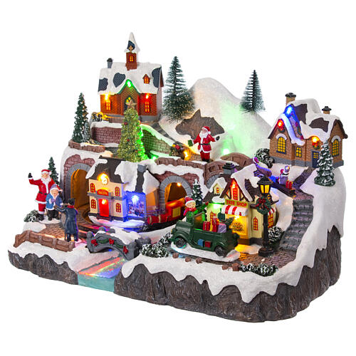 Christmas village set with train and car in motion, 12x16x10 in 4