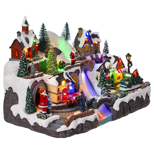 Christmas village set with train and car in motion, 12x16x10 in 6