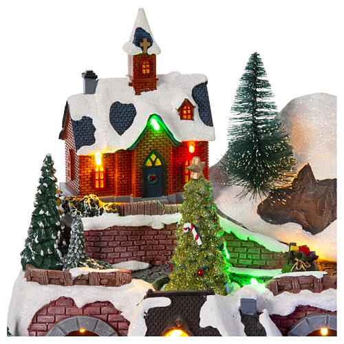 Christmas village set with train and car in motion, 12x16x10 in 7