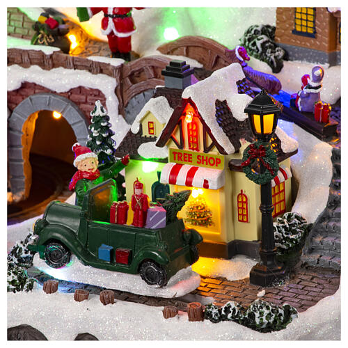 Christmas village set with train and car in motion, 12x16x10 in 8