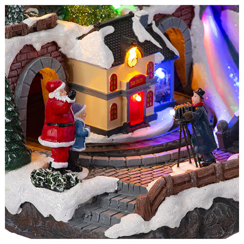 Christmas village set with train and car in motion, 12x16x10 in 9