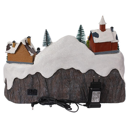 Christmas village set with train and car in motion, 12x16x10 in 10