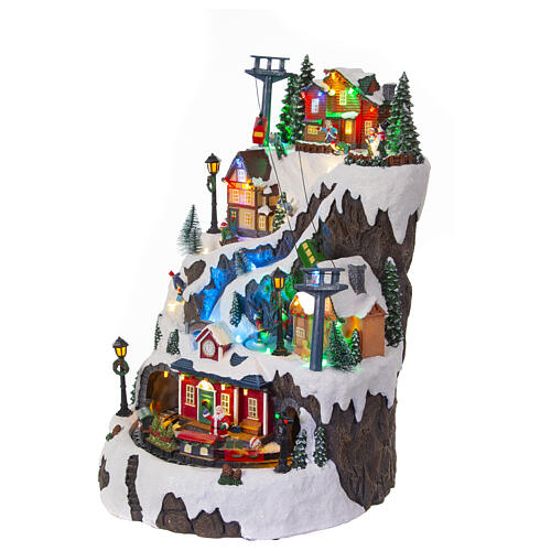 Christmas village set: mountain with train and ice skaters in motion, 18x12x14 in 4