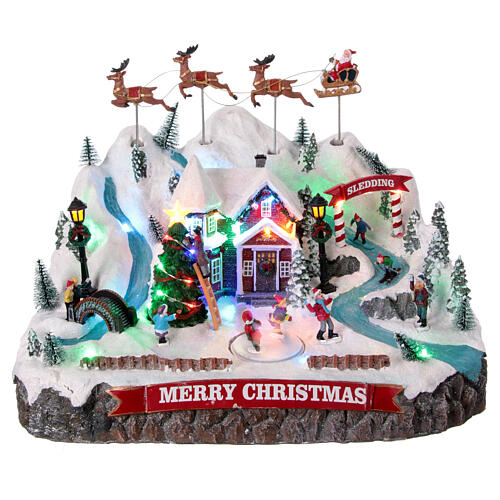Winterszene, verschneite Berglandschaft mit fliegendem Weihnachtsmann, Bewegung und LED-Beleuchtung – 30×40×30 cm 1