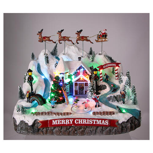 Villaggio montagna innevata Babbo Natale in volo 30x40x30 cm 2