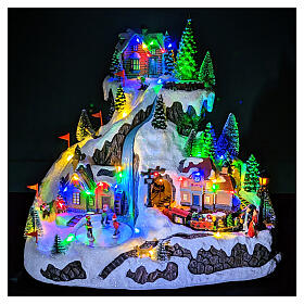 Christmas village on a mountain with train and animated ski slope, 14x16x12 in