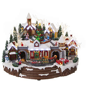 Christmas village set with train and Christmas tree in motion, 14x18x14 in
