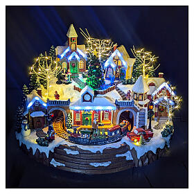 Christmas village set with train and Christmas tree in motion, 14x18x14 in