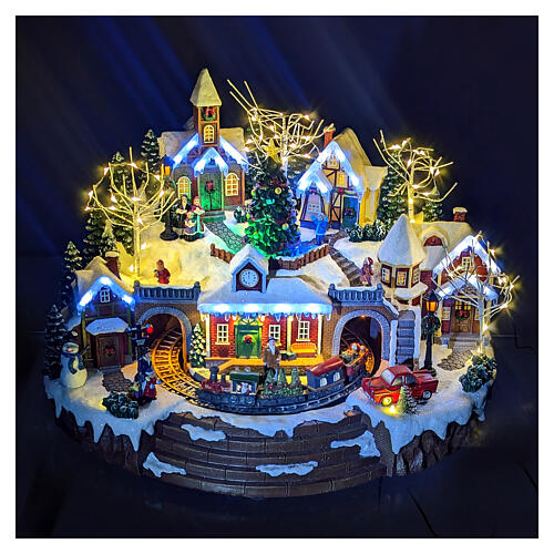 Christmas village set with train and Christmas tree in motion, 14x18x14 in 2