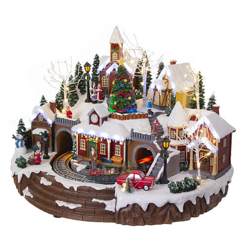 Christmas village set with train and Christmas tree in motion, 14x18x14 in 4