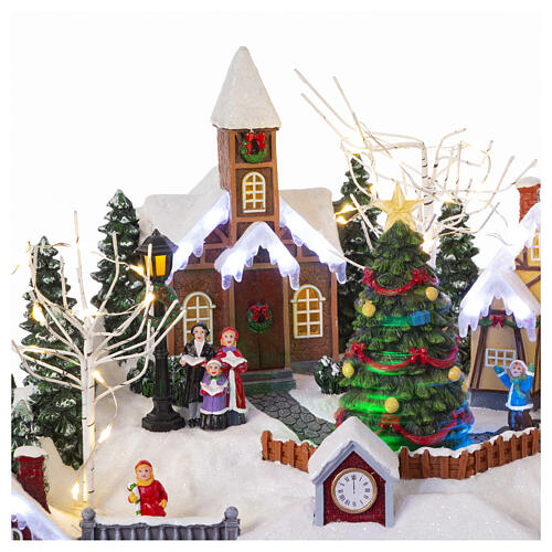 Christmas village set with train and Christmas tree in motion, 14x18x14 in 5
