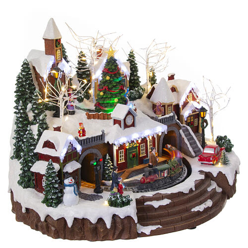 Christmas village set with train and Christmas tree in motion, 14x18x14 in 6