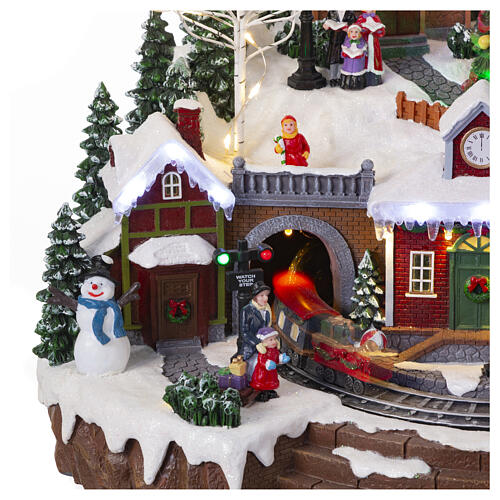 Christmas village set with train and Christmas tree in motion, 14x18x14 in 8