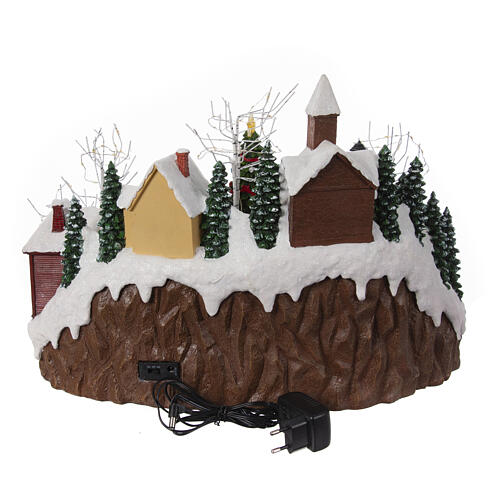 Christmas village set with train and Christmas tree in motion, 14x18x14 in 9