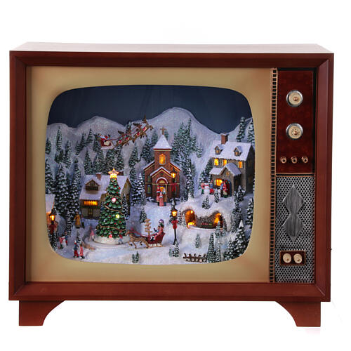 Vintage television with miniature Christmas village in motion, 18x24x10 in 1