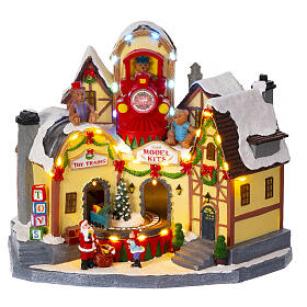 Christmas village set: toyshop with train, 10x8x12 in