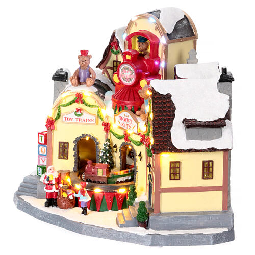 Christmas village toy shop with train 25x20x30 cm 4