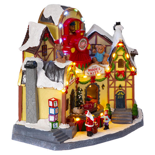 Christmas village toy shop with train 25x20x30 cm 6