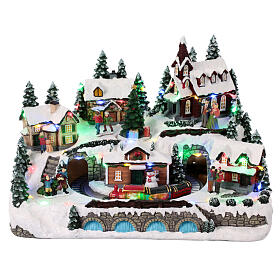 Christmas village with train in motion and spinning tree, 10x12x10 in
