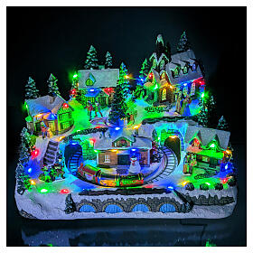 Christmas village with train in motion and spinning tree, 10x12x10 in
