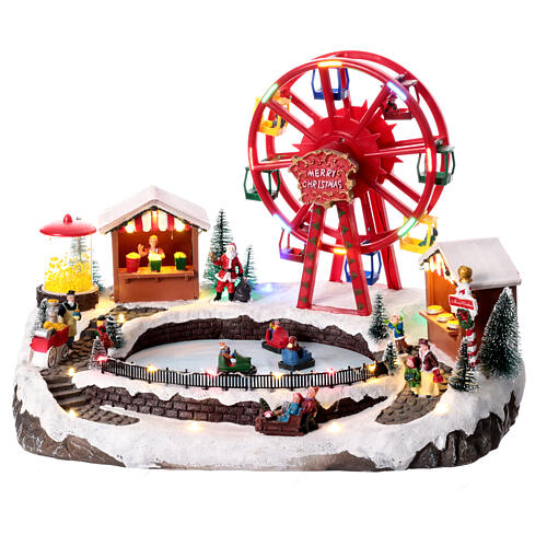 Pueblo navideño con tiovivos 30x30x45 cm 1