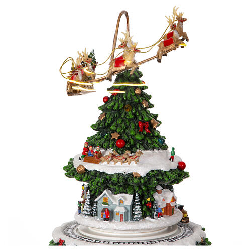 Christmas village set: Christmas tree with train in motion and Santa's sleigh, 20x10x10 in 3