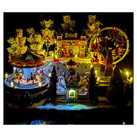 Christmas village with carousel and big wheel, LED lights and music, 12x18x14 in