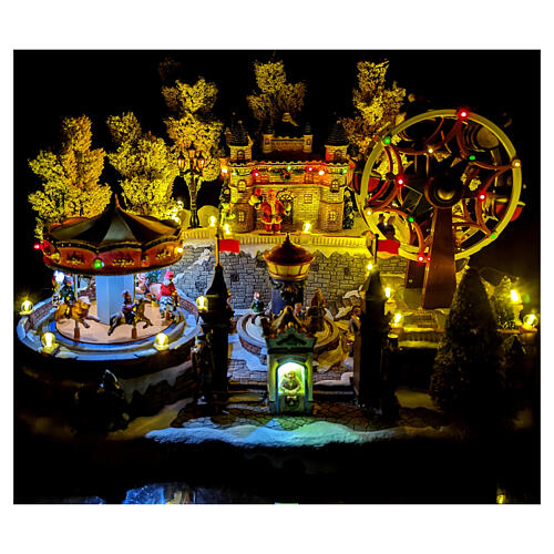 Christmas village with carousel and big wheel, LED lights and music, 12x18x14 in 2