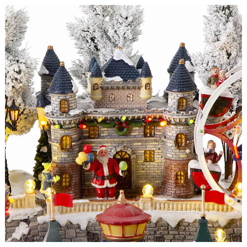 Christmas village with carousel and big wheel, LED lights and music, 12x18x14 in 4