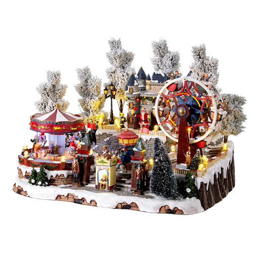 Christmas village with carousel and big wheel, LED lights and music, 12x18x14 in 5