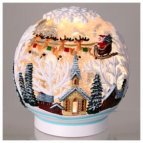 Boule à neige éclairée paillettes traîneau Père Noël 15x15x15 cm