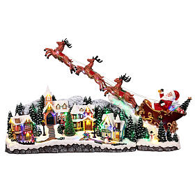 Weihnachtslandschaft mit fliegendem Weihnachtsmann, Schlitten, Rentieren, LED-Beleuchtung und Musik – 47×97,5×25,5 cm