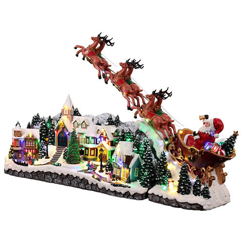 Christmas village with Santa on his sleigh, lights and music, 18x40x10 in 8