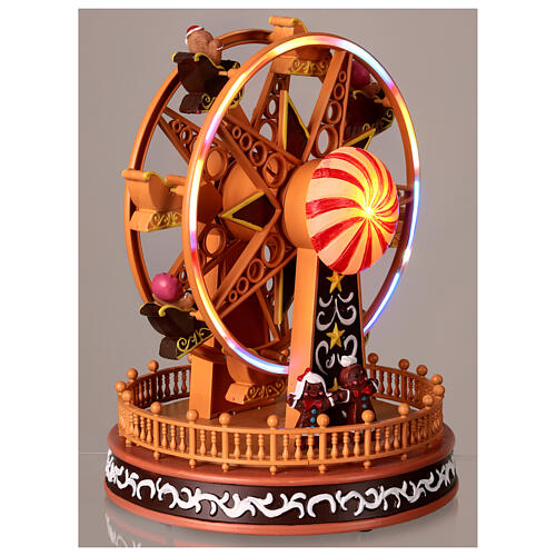 Big wheel with gingerbread finish, motion lights and music, 10x8x8 in 4