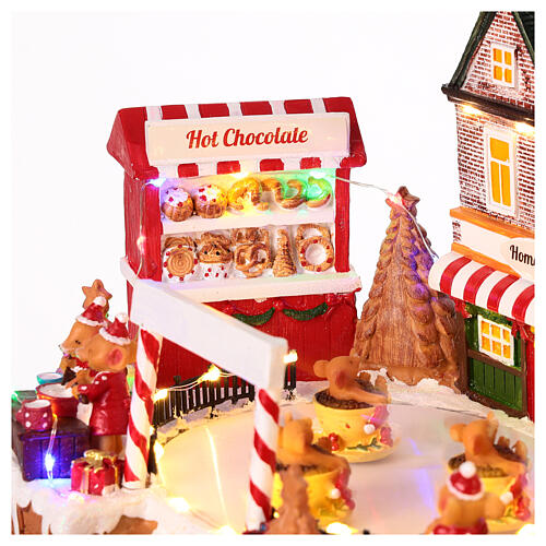 Christmas village set, rink with teacup ride, lights and music, 10x14x8 in 3