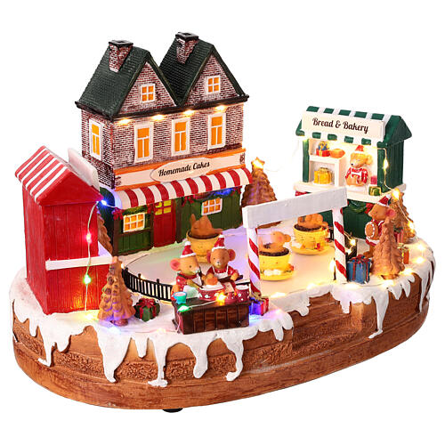 Christmas village set, rink with teacup ride, lights and music, 10x14x8 in 6