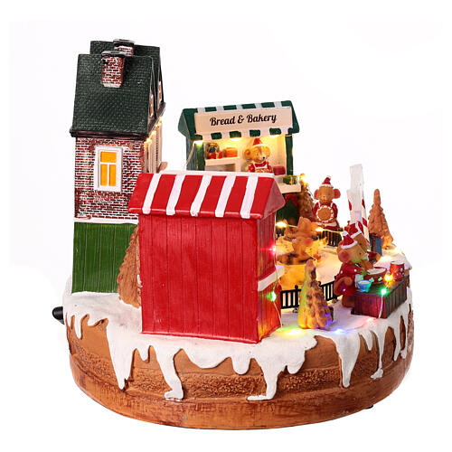 Christmas village set, rink with teacup ride, lights and music, 10x14x8 in 8