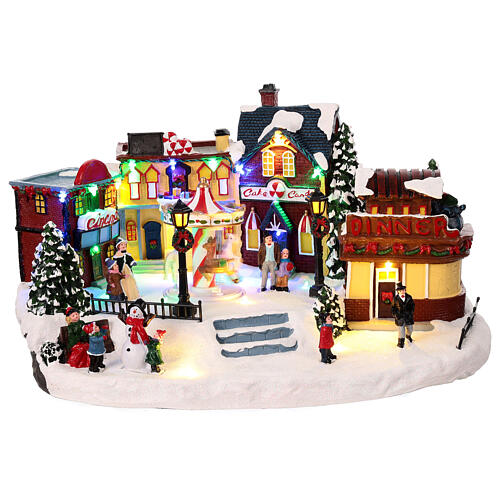 Christmas village with merry-go-round, motion lights and music, 8x16x12 in 1