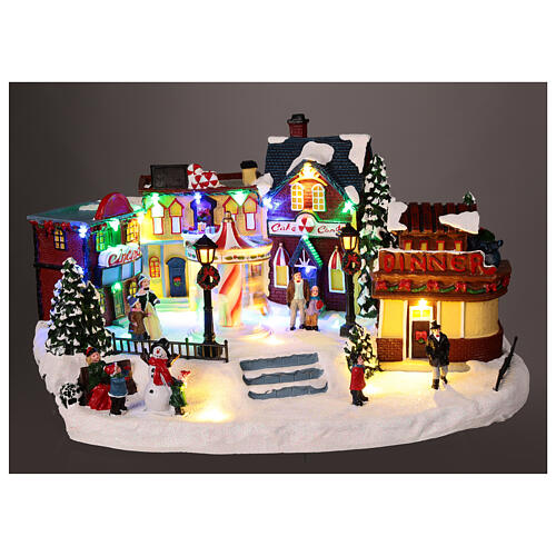 Christmas village with merry-go-round, motion lights and music, 8x16x12 in 2