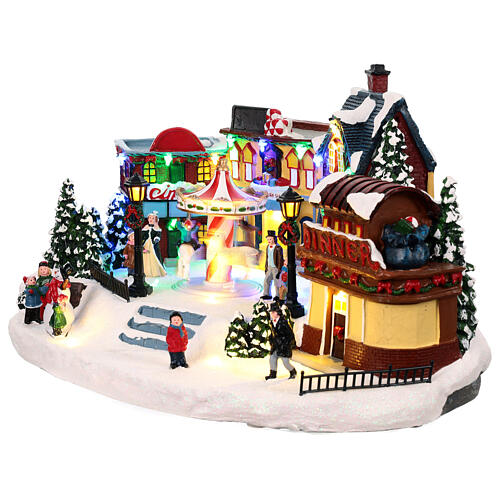 Christmas village with merry-go-round, motion lights and music, 8x16x12 in 3