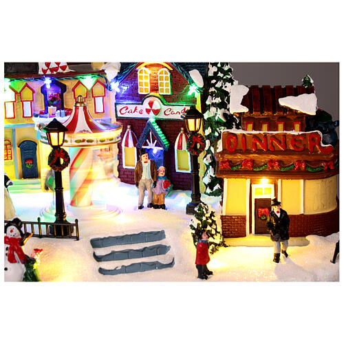 Christmas village with merry-go-round, motion lights and music, 8x16x12 in 4