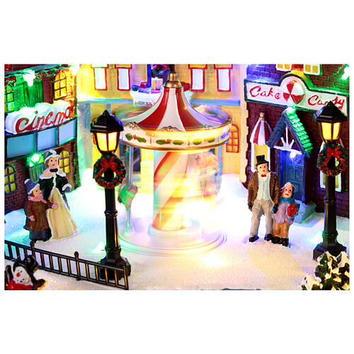 Christmas village with merry-go-round, motion lights and music, 8x16x12 in 6