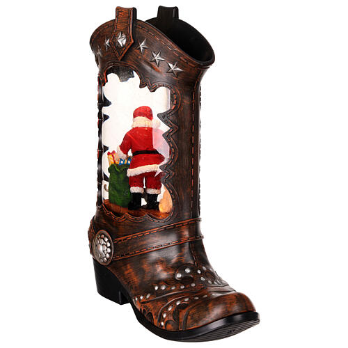 Cowboy boot with Santa Claus, snow globe with lights, music and automatic snowfall, 14x8x4 i 5