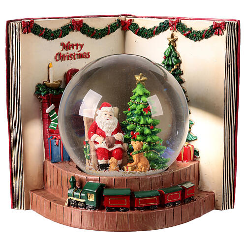 Schneekugel mit Spieluhr, Weihnachtsmann und Hund vor geöffnetem Buch – H 19 cm, 22,5 × 16,5 cm 1