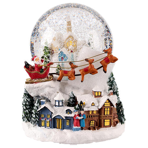 Snow globe with snowy village and Santa on his sleigh, 6x6x6 in 1