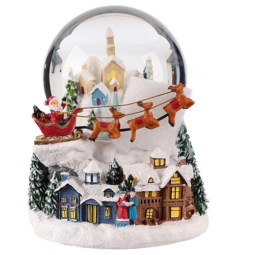 Snow globe with snowy village and Santa on his sleigh, 6x6x6 in 4