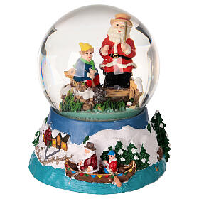 Snow globe with Santa fishing, embossed base and music box, 5x4x4 in