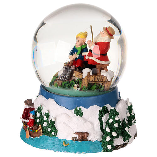 Snow globe with Santa fishing, embossed base and music box, 5x4x4 in 3