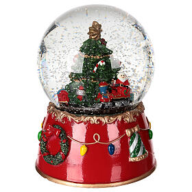 Snow globe: Santa Claus on a train with music box and motion, 6x5 in