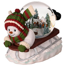 Snow globe: snowman on a sled with lights, music and automatic snowfall, 6x8x6 in